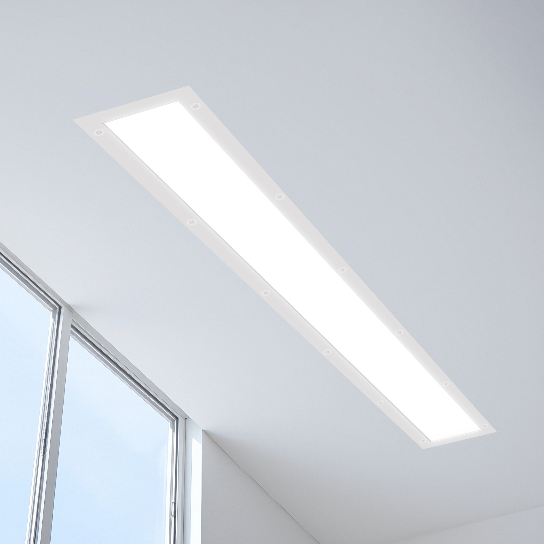 white room with a diagonal ceiling a window